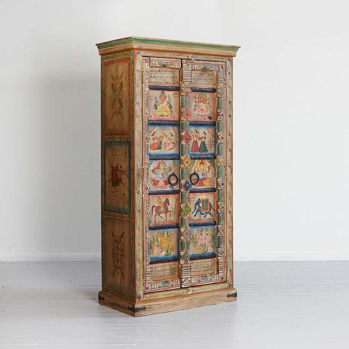 Decorative wooden cabinet with painted scenes on a white background