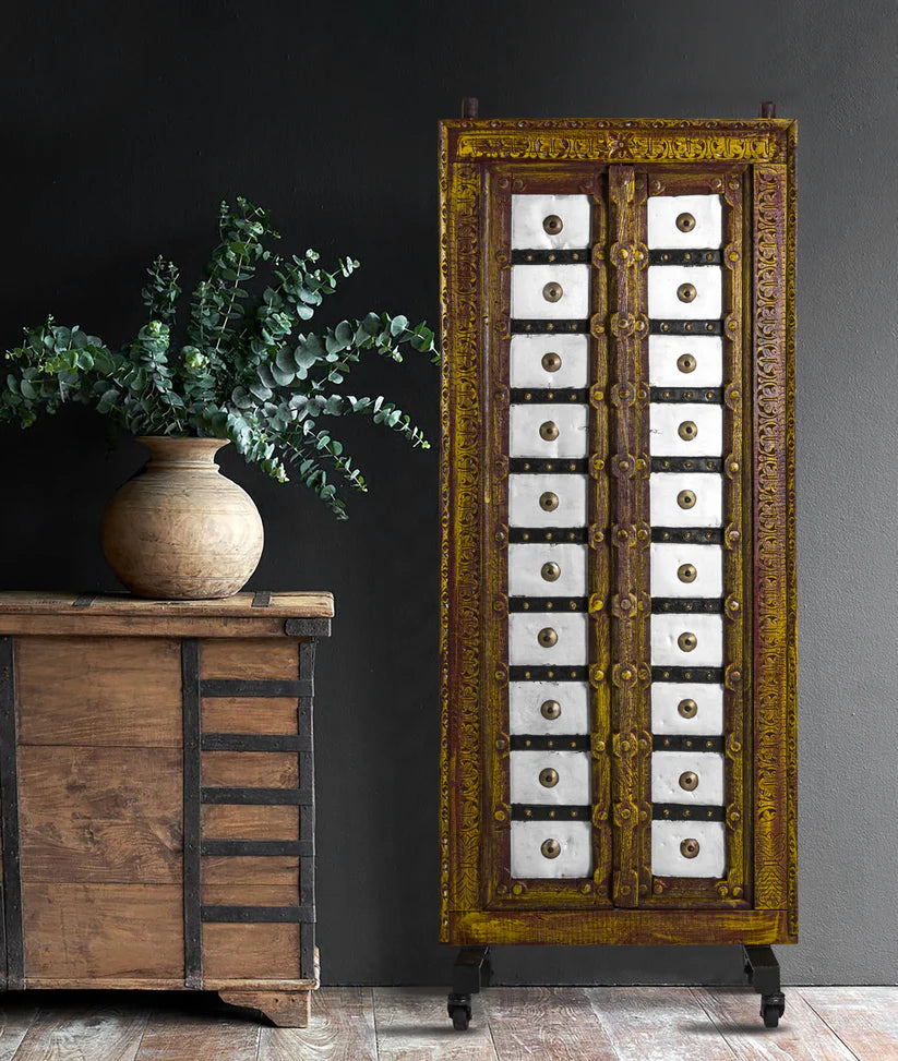 Vintage Indian wooden door with iron stand, distressed mustard yellow finish, 64 × 164 cm.

Handcrafted solid wood Indian door panel with carved border and castor base.

Tall antique-style Indian door decor in mustard yellow, made in India.

Meta description