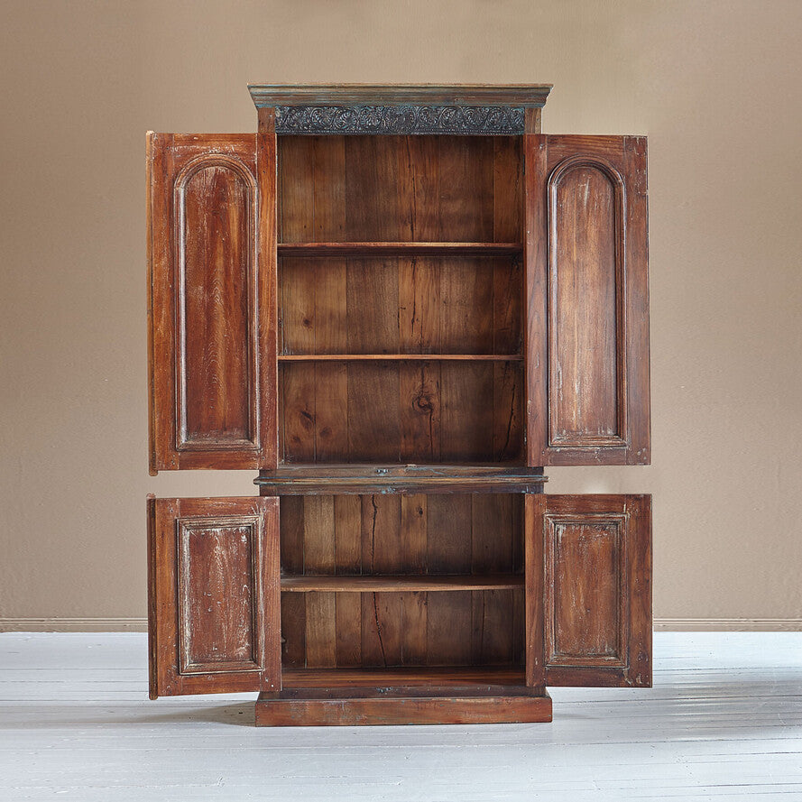 Wooden cabinet with open doors on a plain background