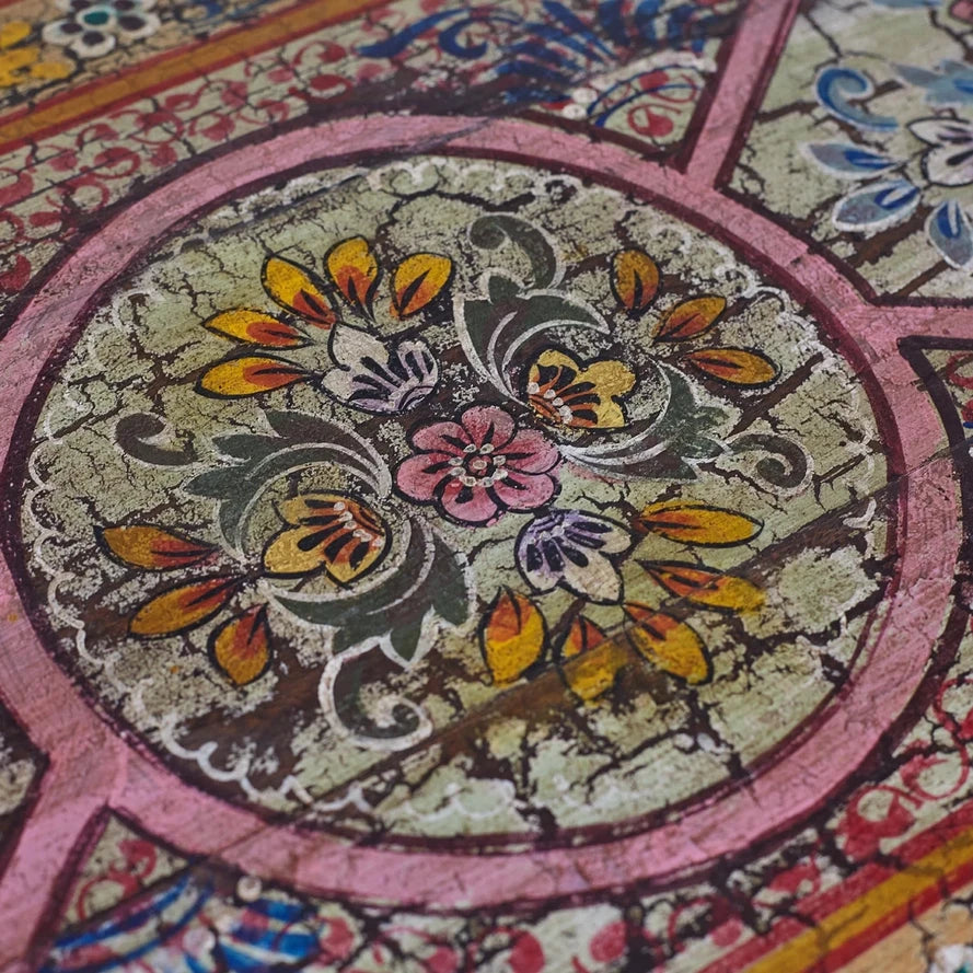 Close-up of a colorful floral pattern on a textured surface
