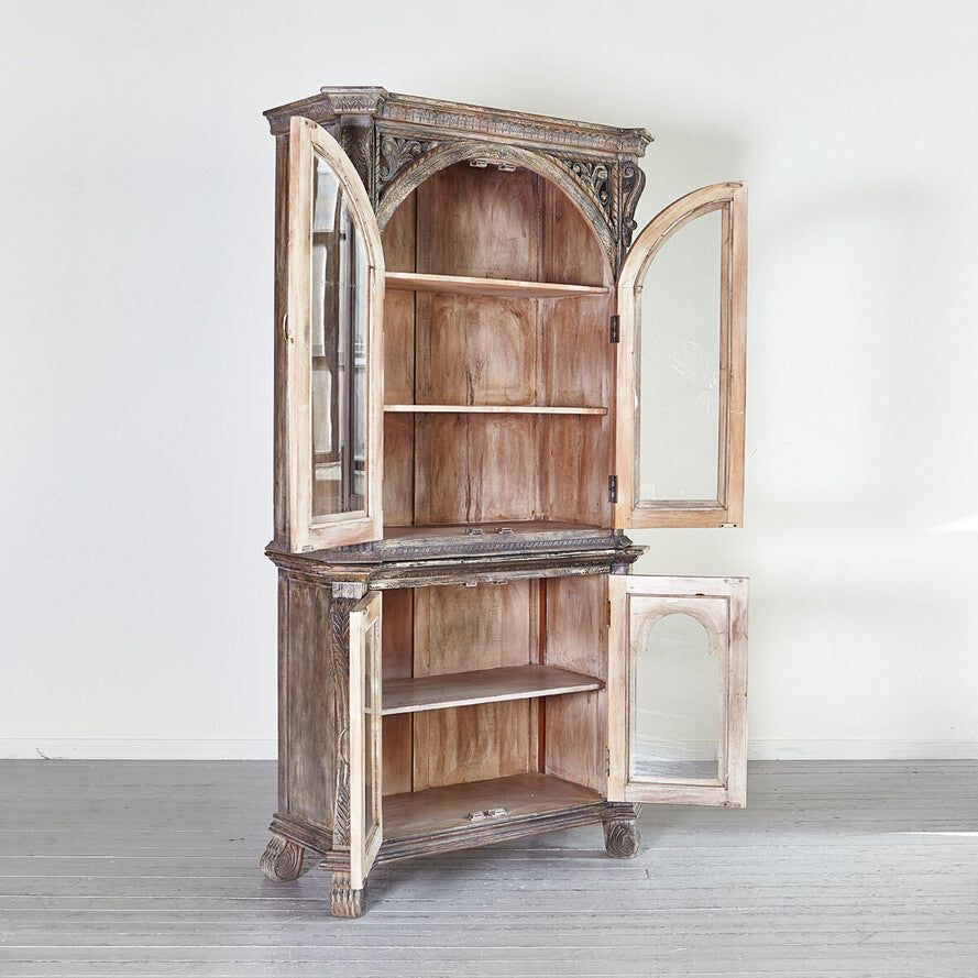 Vintage wooden cabinet with glass doors on a white background