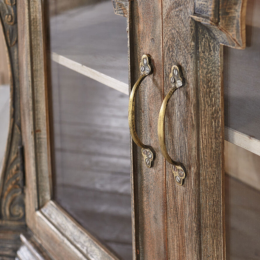 Wooden cabinet with decorative handle and mirror