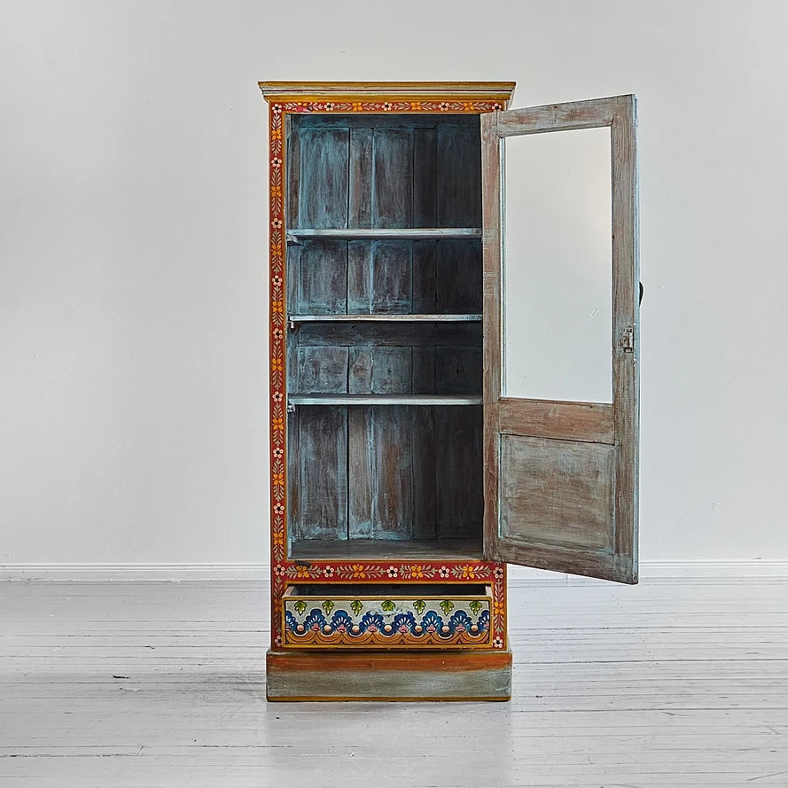 Wooden cabinet with decorative elements on a white background
