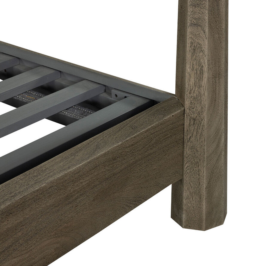 Wooden bed frame with metal slats on a white background