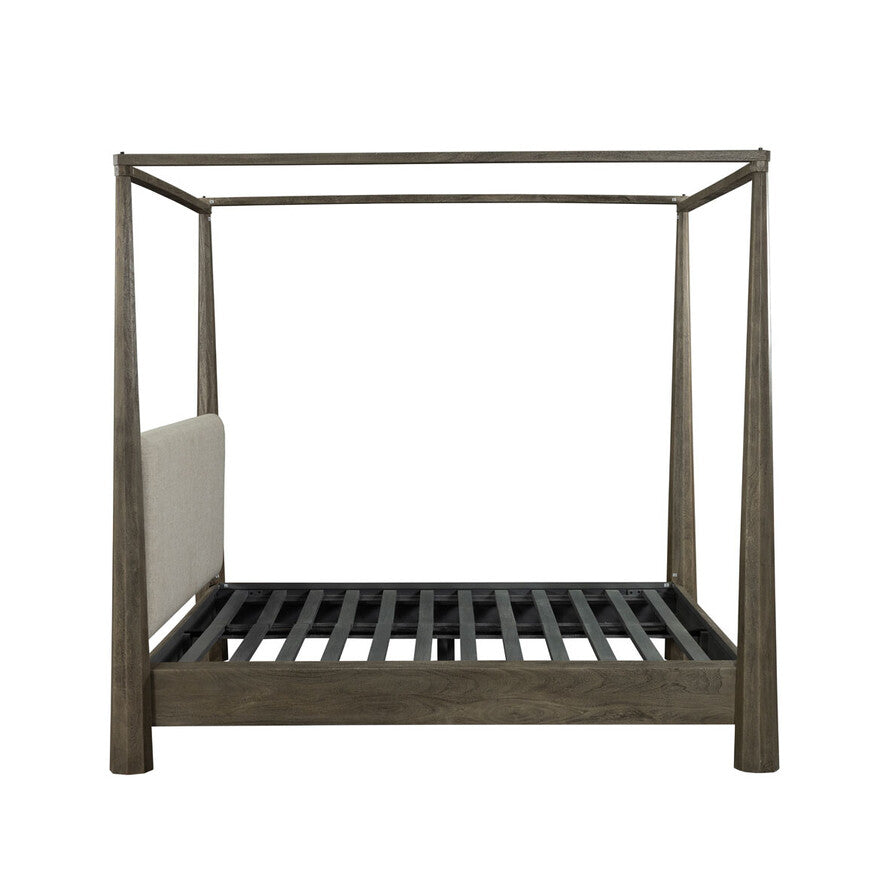 Wooden canopy bed frame on a white background