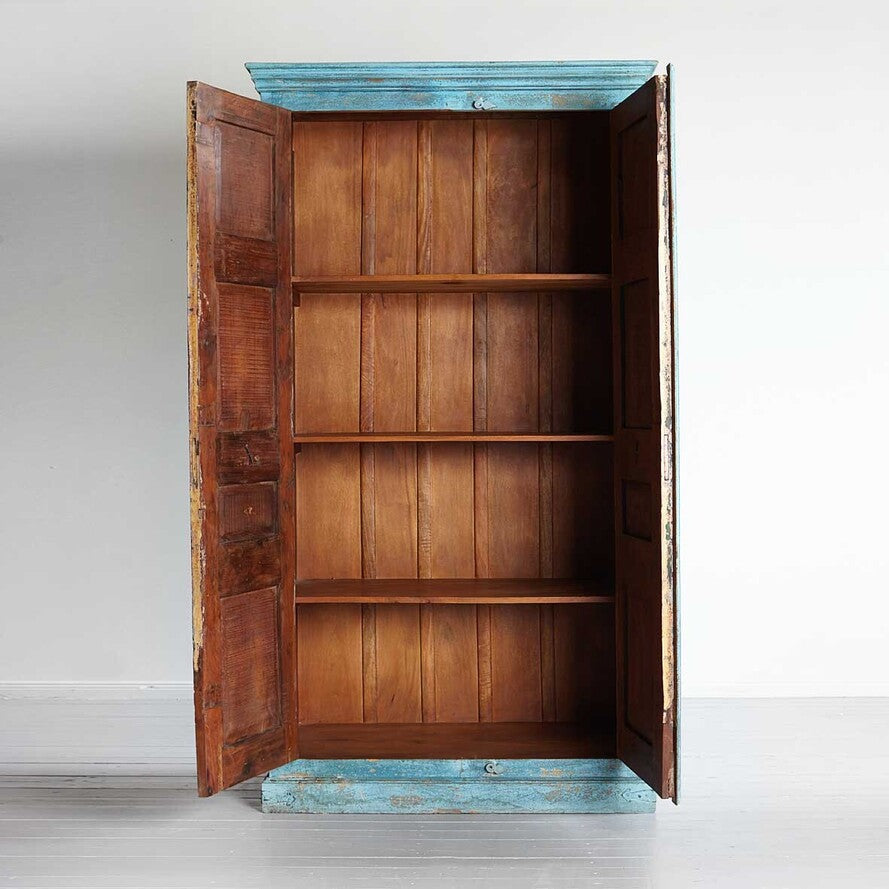 Wooden wardrobe with open doors on a white background