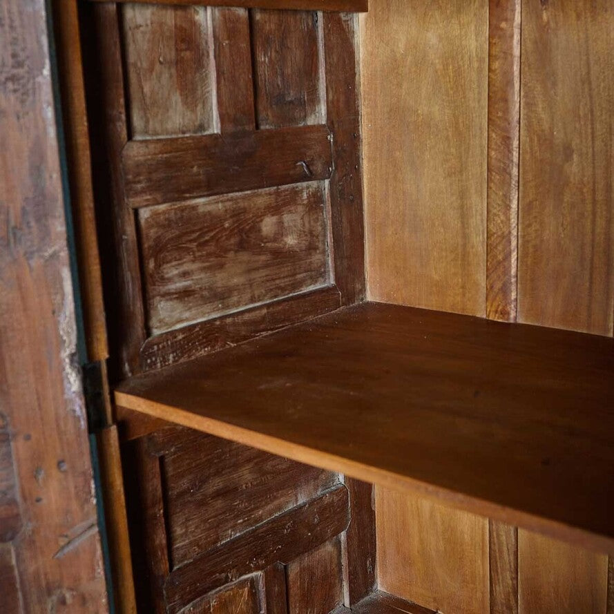 Wooden bench with panelled walls in a rustic setting