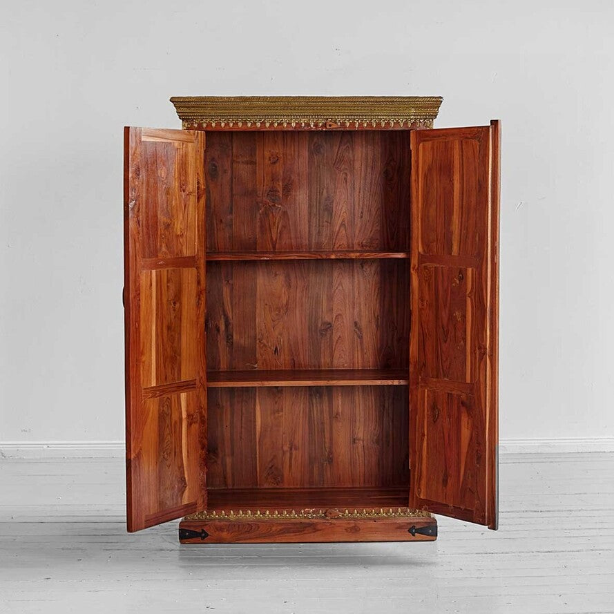 Wooden wardrobe with open doors on a light gray background