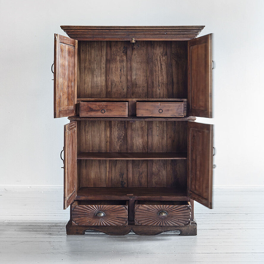 Wooden cabinet with open doors on a white background