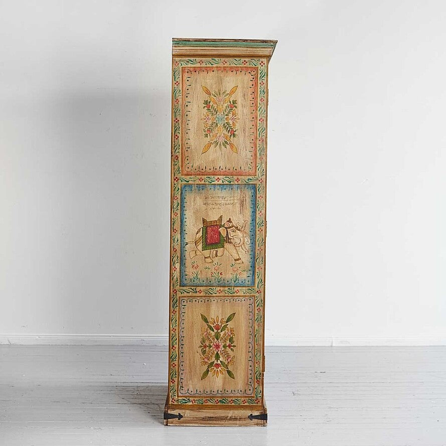 Tall wooden cabinet with floral and abstract designs on a white background