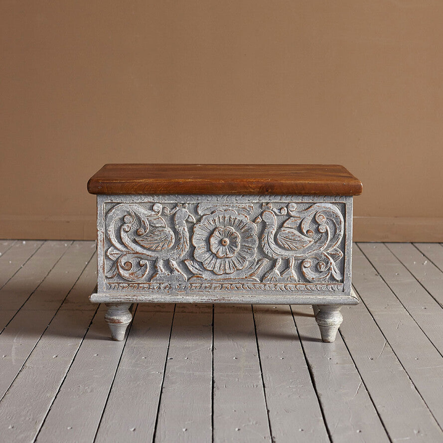 Hand‑carved mango wood storage trunk in distressed grey, 60 × 36 × 36 cm.

