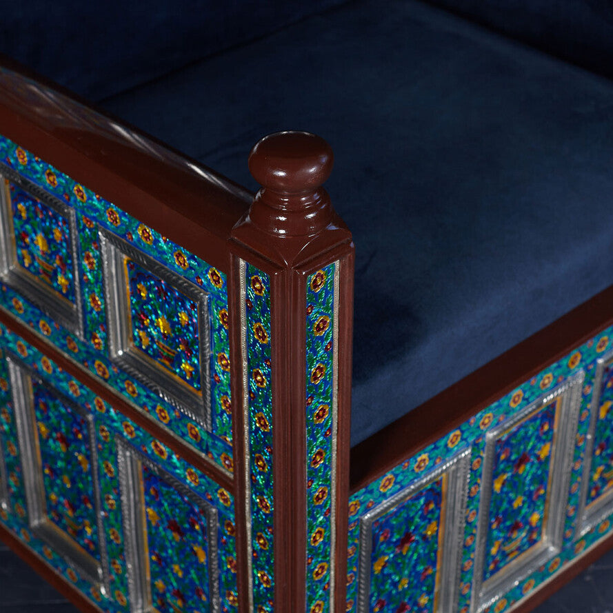 Decorative headboard with intricate patterns on a dark background