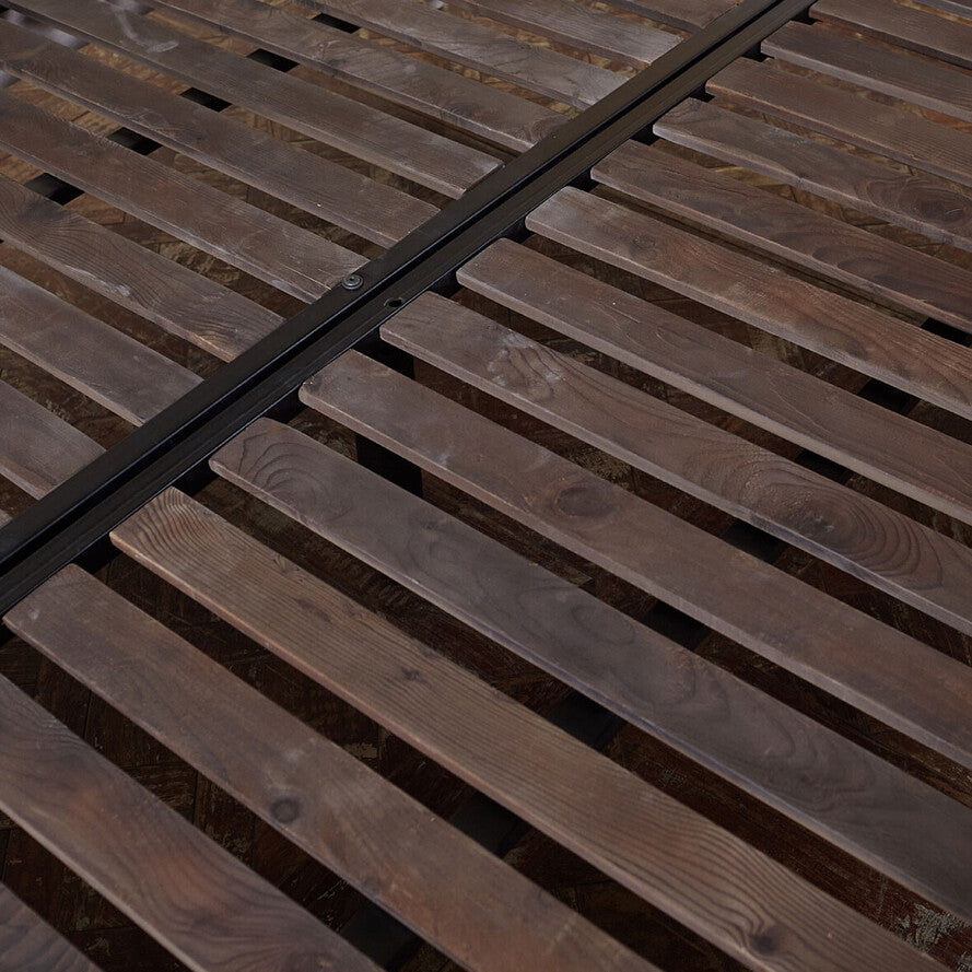Close-up of wooden slats with a dark brown finish