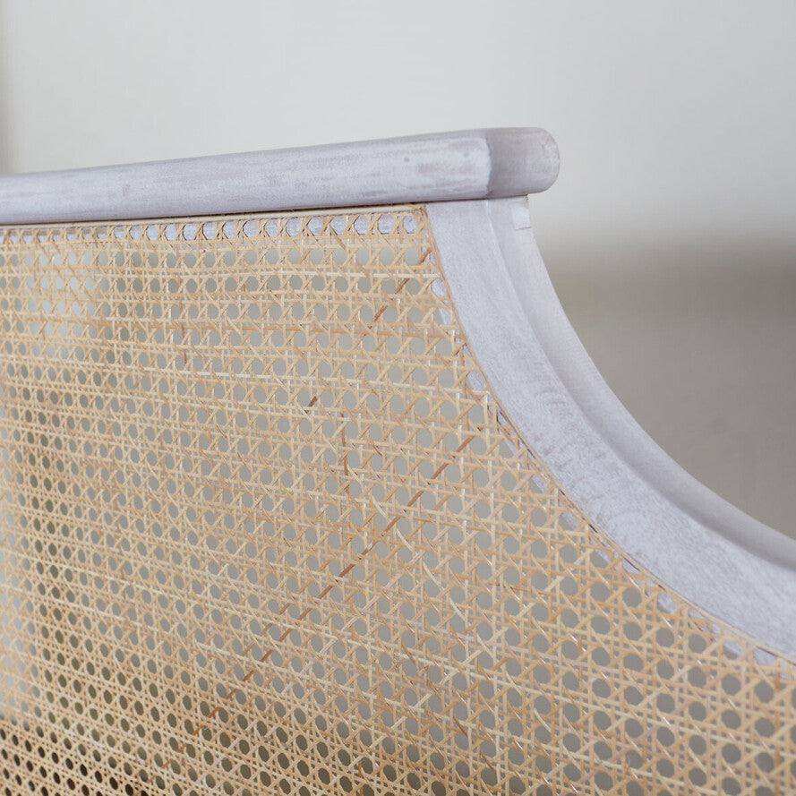 Close-up of a textured beige fabric with a white border on a light gray background