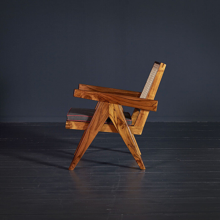Wooden chair with a dark gray background