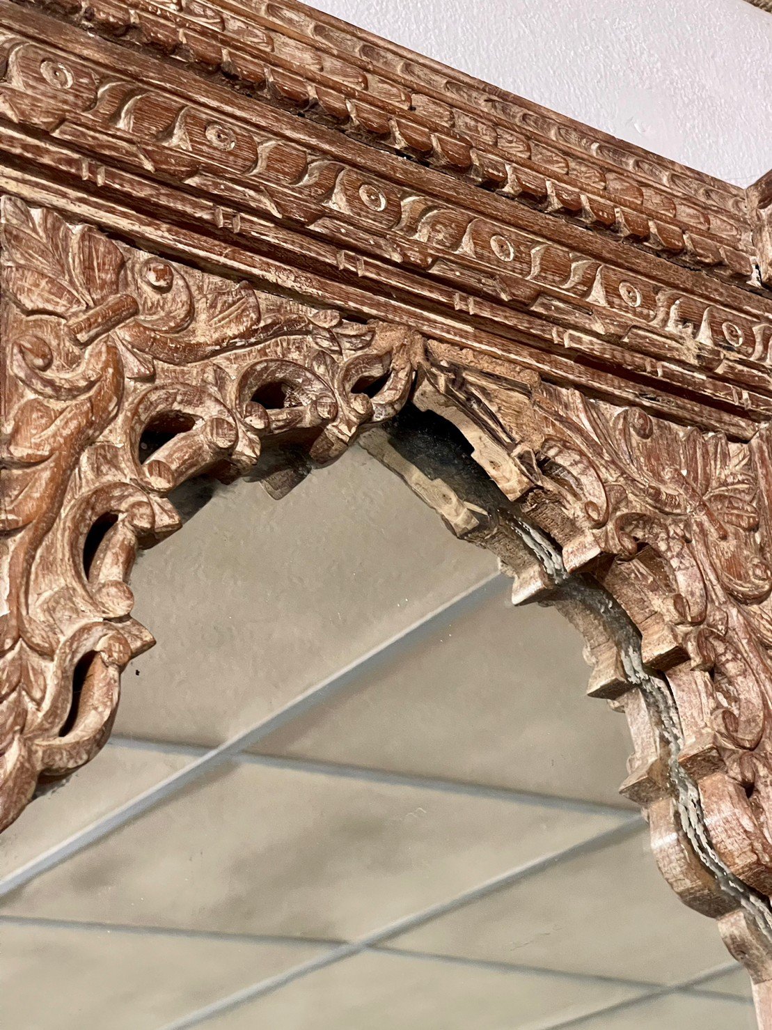 arched wooden mirror