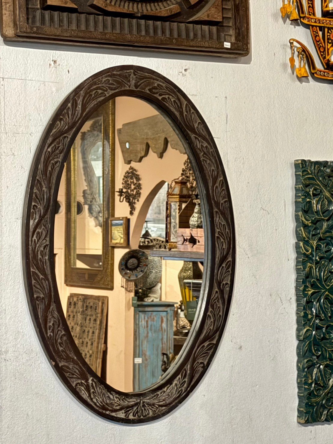 carved oval mirror