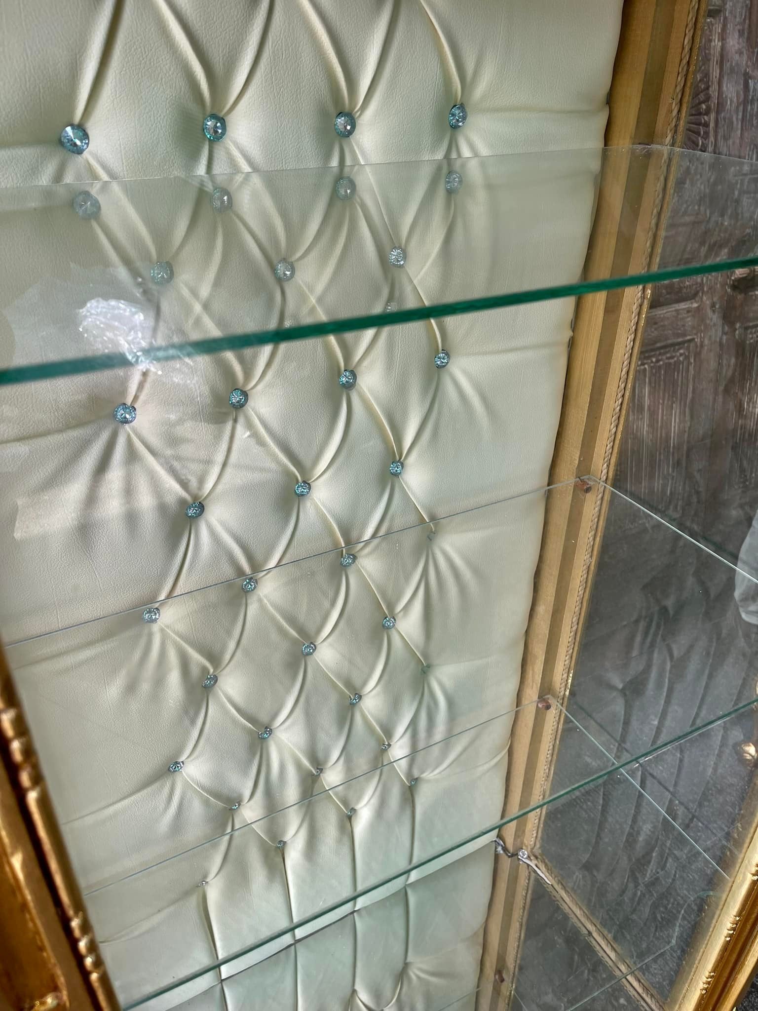 gilded glass display cabinet