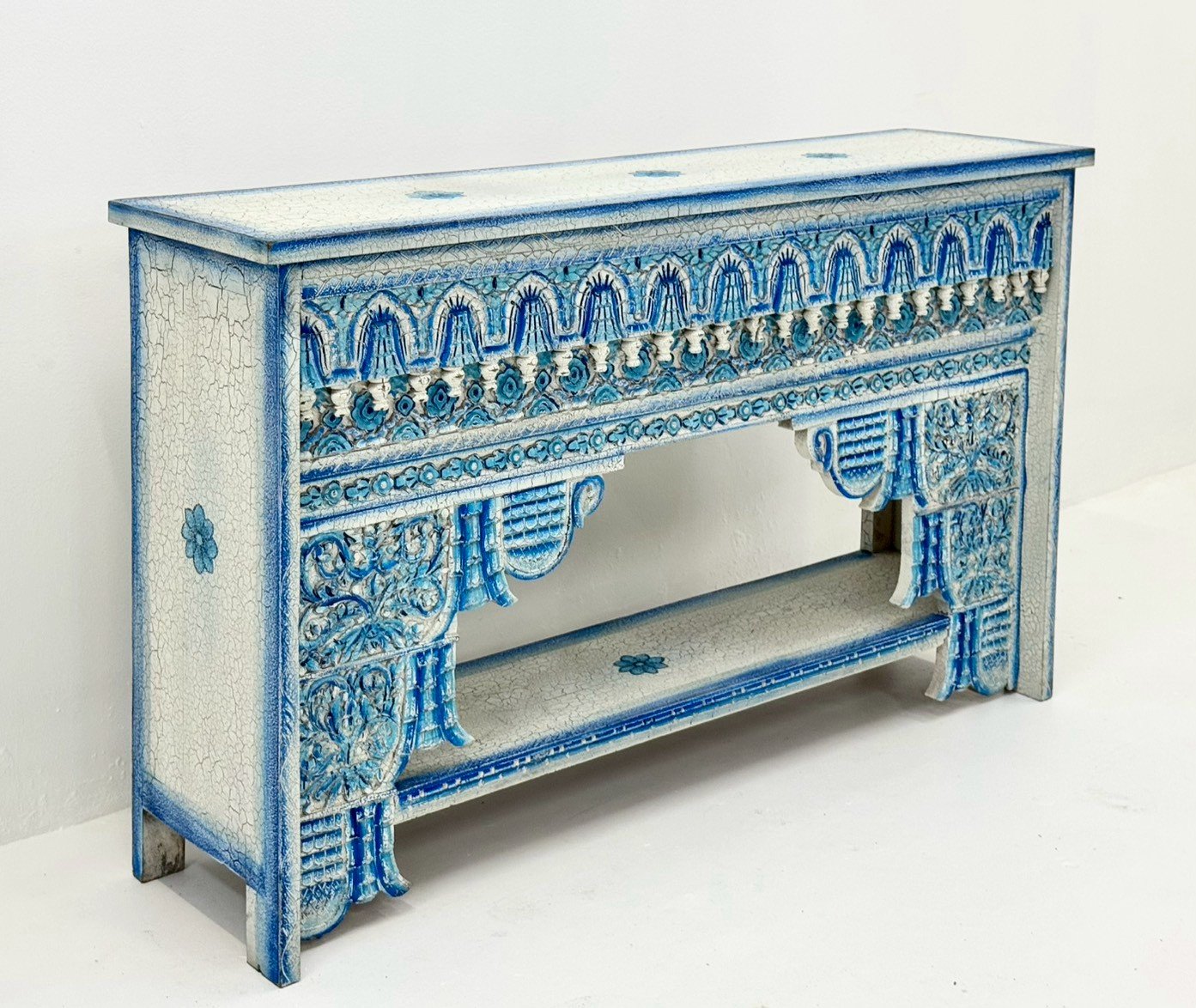 Hail Console Table – Vibrant Teal-Blue Distressed Finish, Intricately Carved Apron with Arches & Openwork, Tapered Legs, Low-Set Open Shelf, Mango Wood, Painted Finish (150 × 38 × 90 cm) - RIVO HOMES