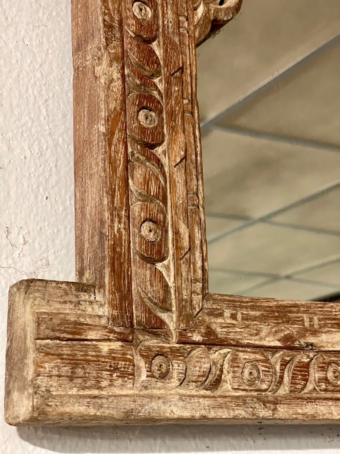 hand-carved wooden mirror