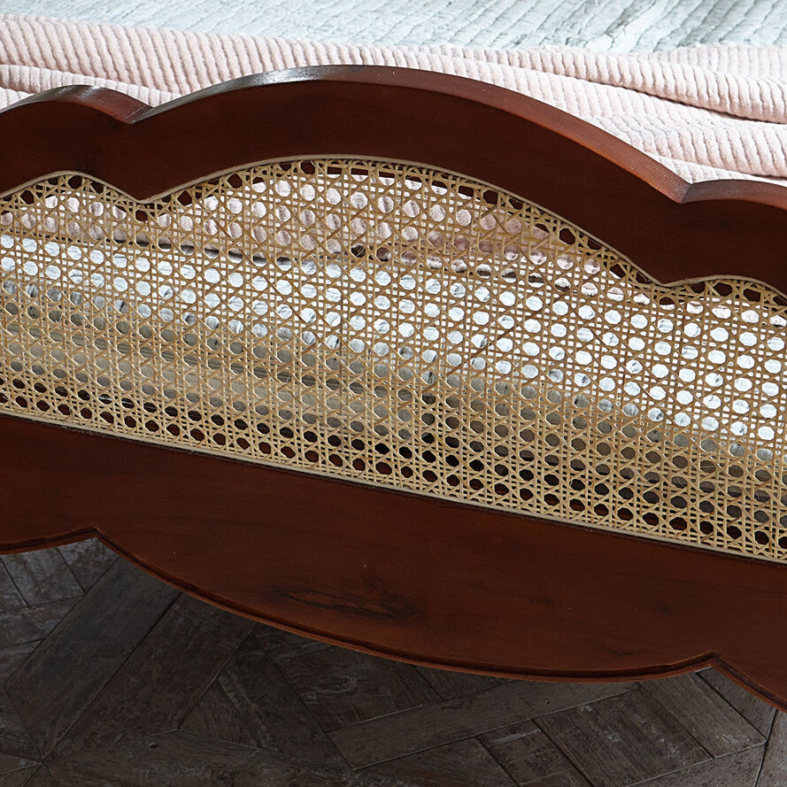 Wooden chair with wicker seat on a wooden floor
