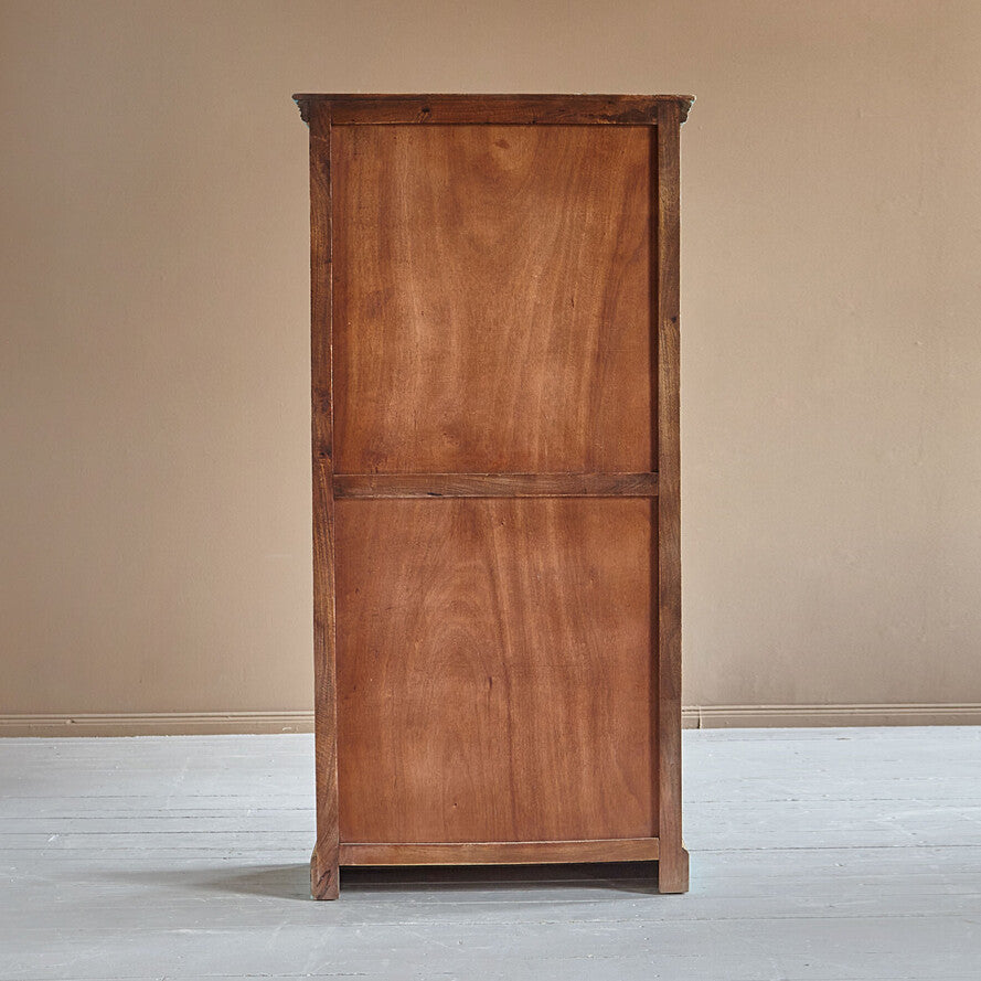 Wooden cabinet against a beige wall