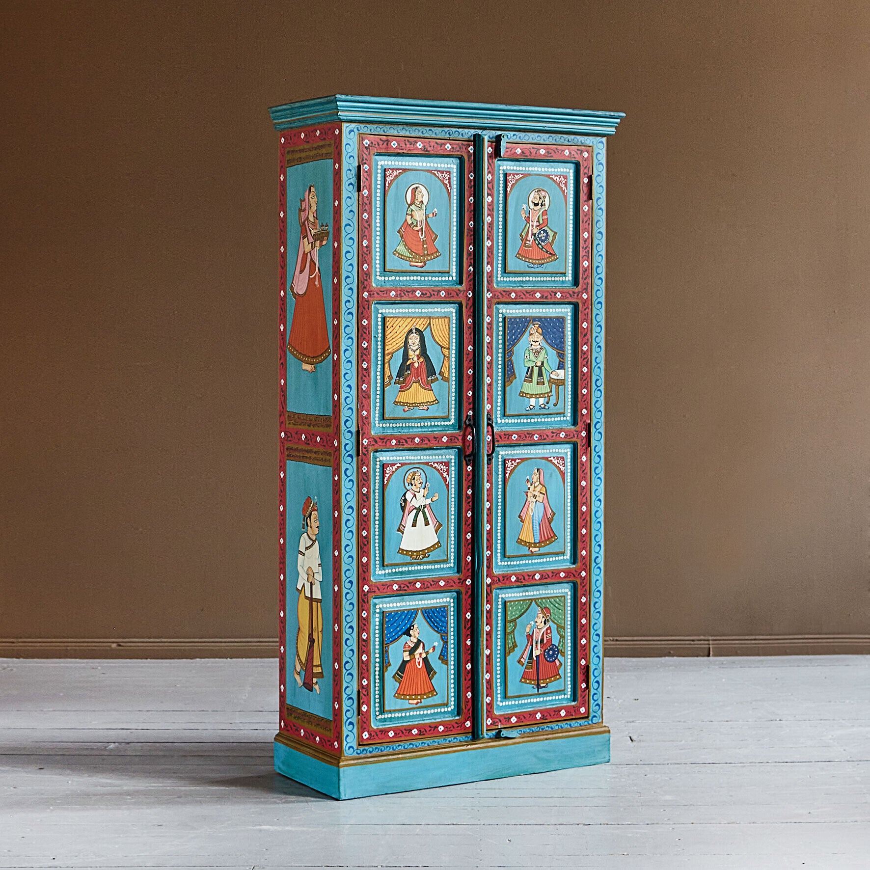 Decorative cabinet with painted designs on a brown background
