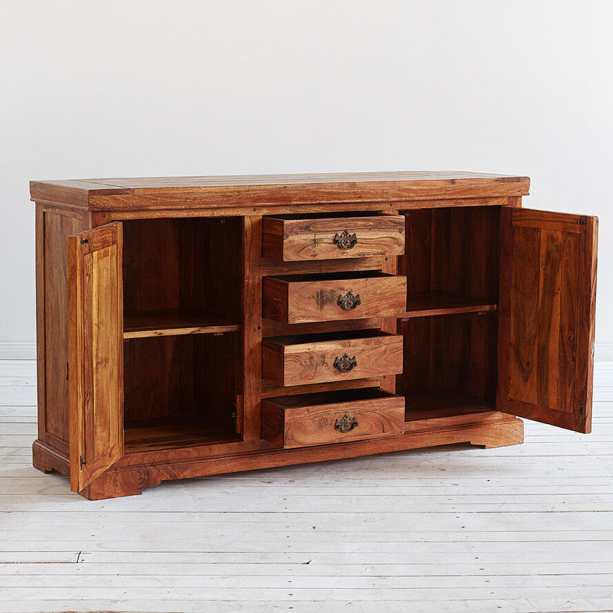 Wooden sideboard with open doors on a light wooden floor.